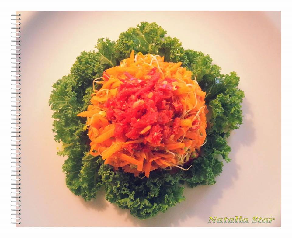 Carrot Cake Salad  - grated carrot and alfalfa sprouts on top  of kale