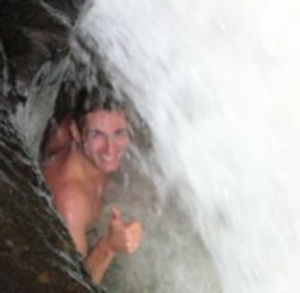Michael Ducharme bathing in a waterfall in Panama
