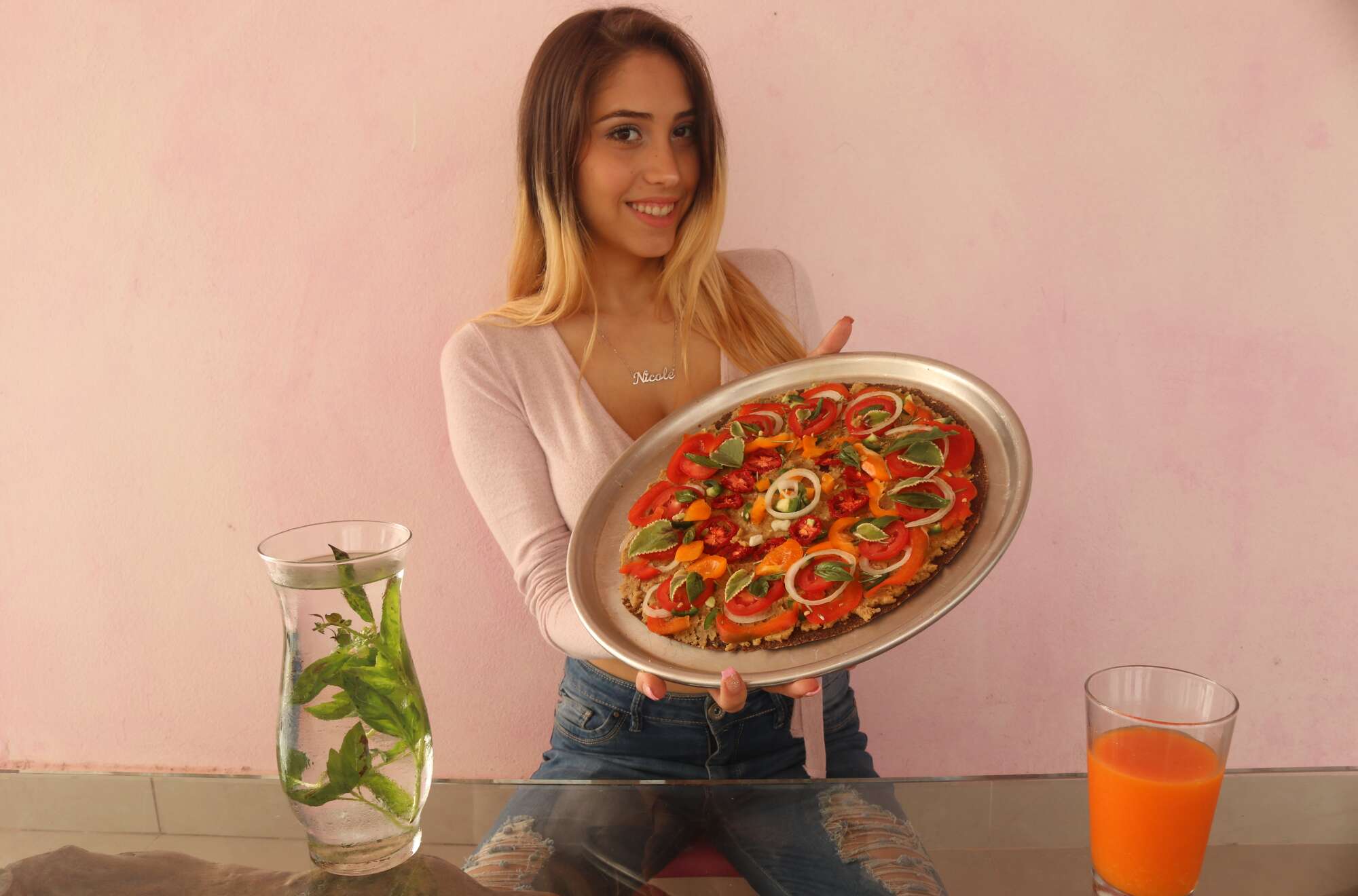 Nicole Vladić with a Raw Vegan Pizza, basil infusion and orange-carrot juice. 