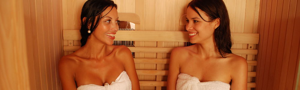 Two ladies relaxing in a sauna